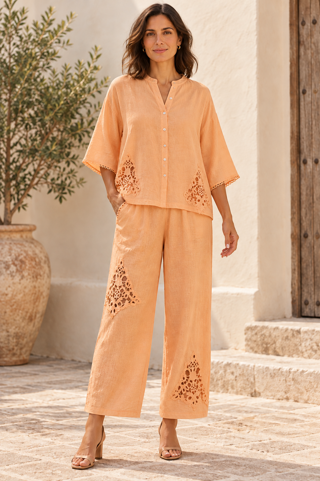 Peach Italian two-piece set with floral openwork pants and scalloped cuffs