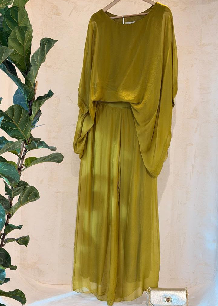 Italian Silk Two-Piece Set — olive green asymmetric top and pleated pants on hanger