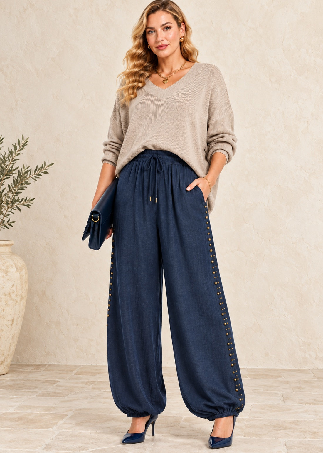 navy viscose balloon jogger pants with staggered antique brass studs and elastic ankle cuffs