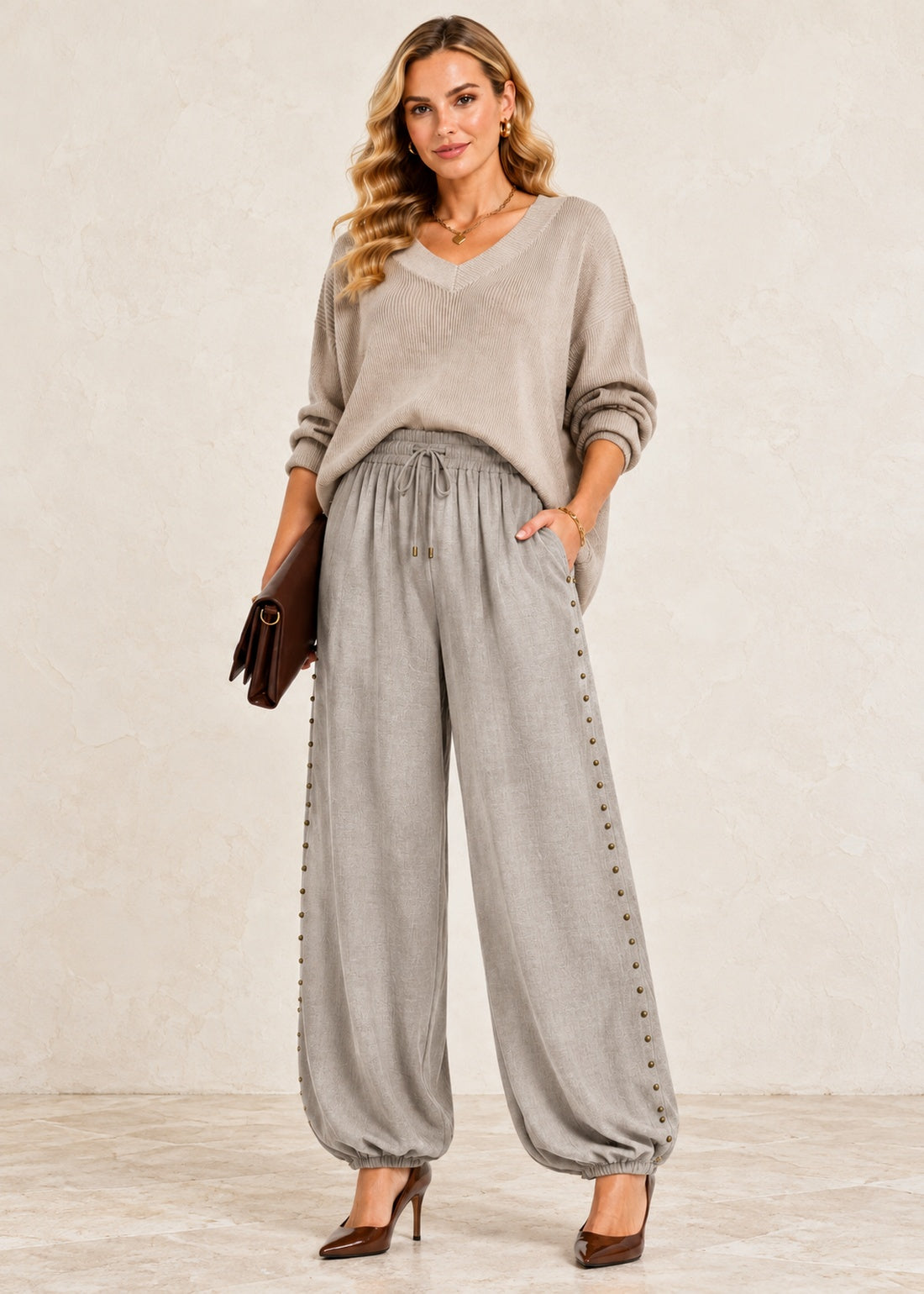Light taupe viscose balloon jogger pants with antique brass side studs and elastic ankle cuffs