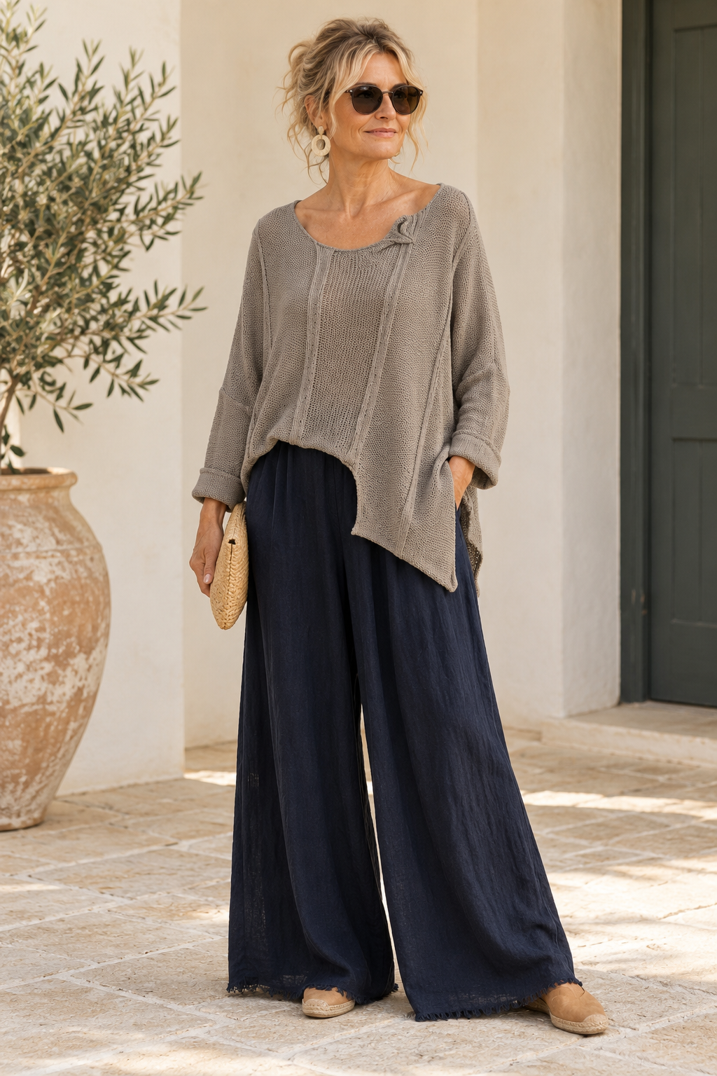 Taupe Italian cotton poncho sweater on a model, showing asymmetric front hem and folded neckline detail